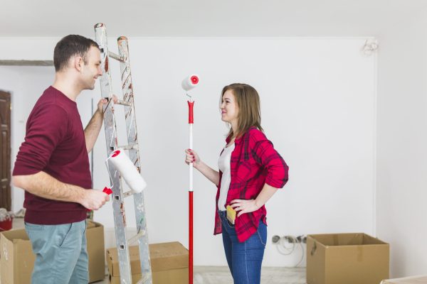 side-view-couple-with-paint-rollers-ladder Interior support